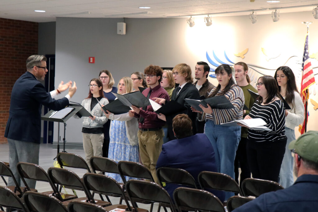 The SIC Concert Choir performs “God Bless America” as part of the Veterans Recognition Ceremony honoring military service members.